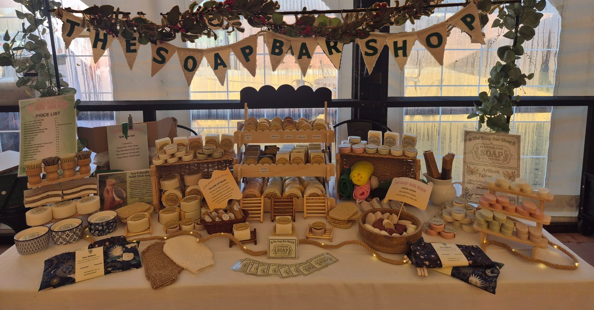 The Soap Bar Shop stall, with the hessian banner above the handmade soaps