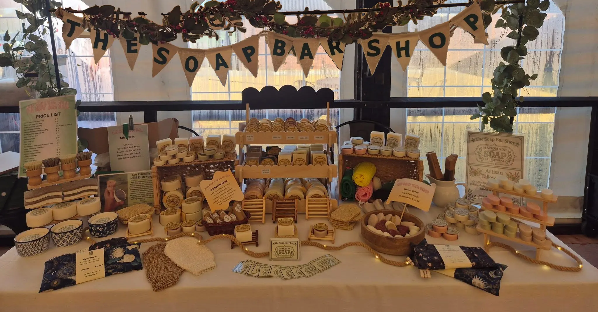 The Soap Bar Shop stall, with the hessian banner above the handmade soaps